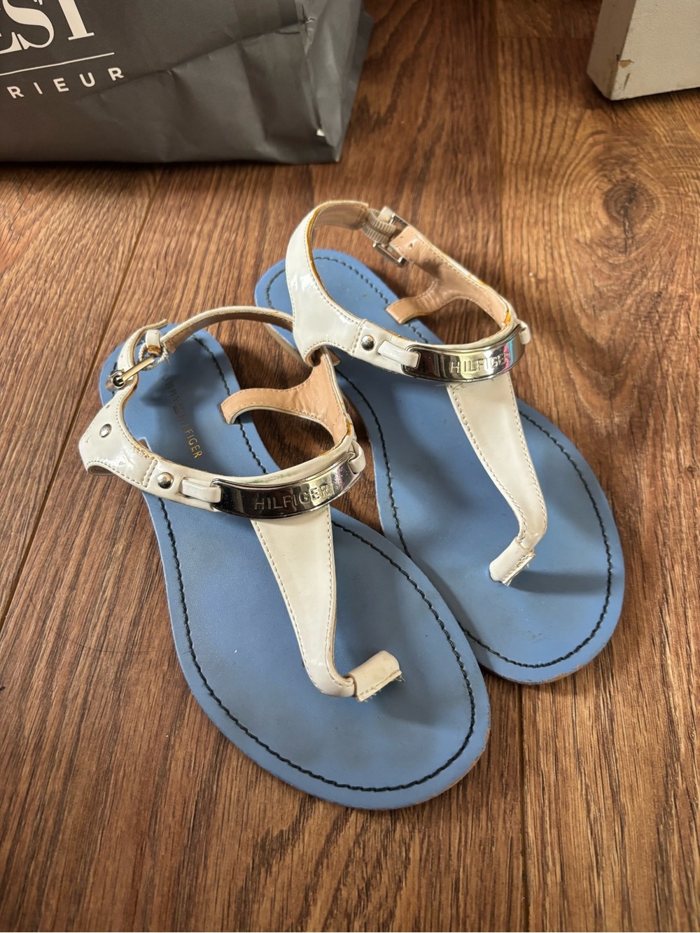 Tommy Hilfiger White Leather T-Strap Sandals with Blue Footbed and Gold Accent